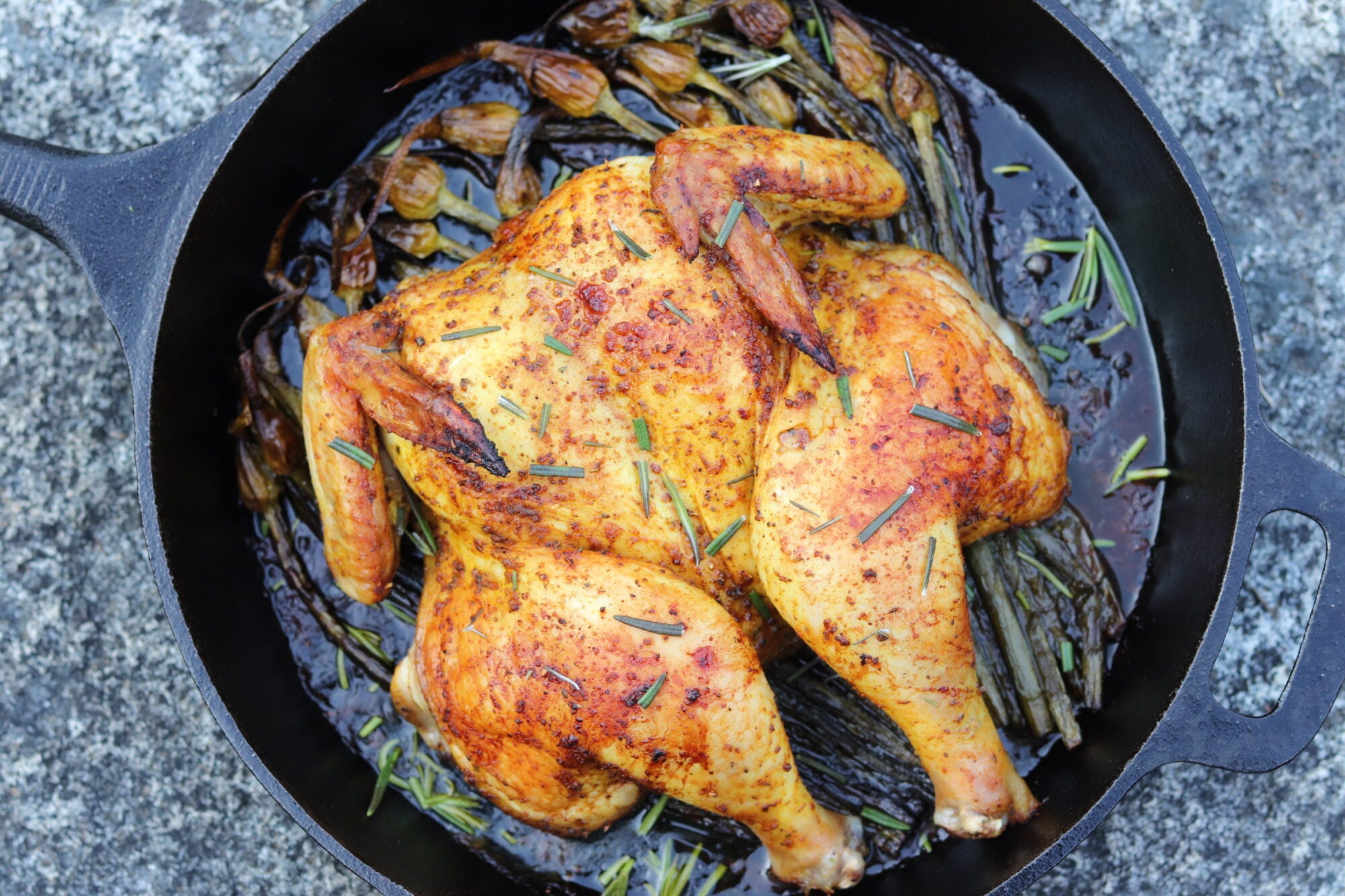 Garlicky Herbed Spatchcock Chicken Roast with Grapes and Onions